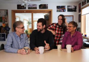 Zach Wahls with moms & sibling at kitchen table